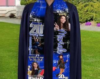 May include: Blue and black graduation sash with a silver glitter design. The sash has the text "Class of 20 twenty five Southfield High School" and "She believed she could So she did" with a photo of a girl in a graduation cap and gown. The sash also has the text "Congratulations Mariah" and a photo of a girl in a cap and gown holding a trophy. The sash has the text "Mariah" and a photo of a girl in a crown.