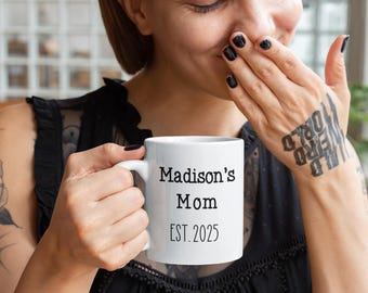 May include: White ceramic mug with black text that reads "Madison's Mom EST. 2025".
