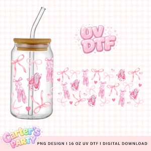 May include: A clear glass tumbler with a bamboo lid and a curved glass straw. The tumbler is decorated with pink ballet shoes, bows, and hearts. The words "UV DTF" are in pink bubble letters. The text "Carter's Party" is also visible.
