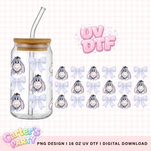 May include: A clear glass tumbler with a bamboo lid and a curved glass straw. The tumbler is decorated with a cartoon donkey and white bows. The words "UV DTF" are in pink bubble letters. The text "PNG DESIGN | 16 OZ UV DTF | DIGITAL DOWNLOAD" is at the bottom.