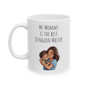 May include: White ceramic coffee mug with a black and white illustration of a mother and child. The text on the mug reads "My Mommy is the Best Dungeon Master."