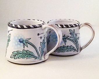 Dandelion coffee mug is a hand painted majolica tea cup or coffee mug. Take a moment to ponder and make a wish or two.