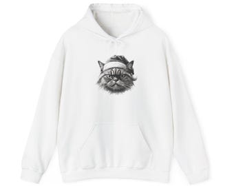 Puede incluir: Sudadera con capucha blanca con una ilustración en blanco y negro de un gato gruñón con un gorro de Papá Noel. La sudadera tiene un bolsillo delantero y una capucha con cordón, ideal para uso casual durante la temporada navideña.