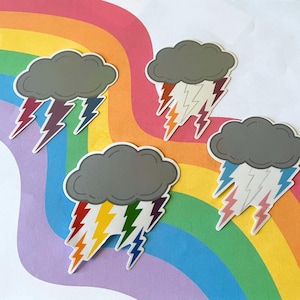 May include: Four stickers depicting gray storm clouds with lightning bolts in various colours, including red, orange, yellow, green, blue, and purple. The stickers are set against a rainbow-patterned background.