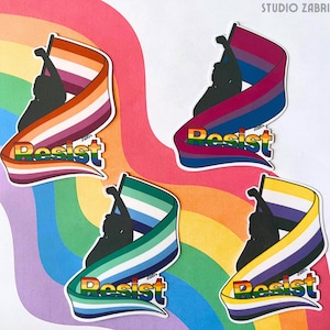 May include: A set of stickers with silhouettes holding flags, each with the word "Resist" in rainbow colours. The flags represent different identities, including lesbian, bisexual, gay, and non-binary pride flags. The background is a rainbow pattern.