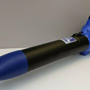 May include: A blue and black Kobalt 40V MAX cordless leaf blower. The blower has a blue nozzle and handle, with the Kobalt logo visible. The body of the blower is black.