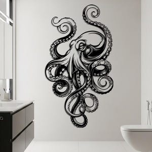 May include: A large black and white octopus wall decal is affixed to a white bathroom wall. The octopus design features detailed tentacles and a stylized body. The decal adds a nautical or marine theme to the bathroom decor.
