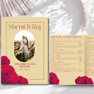 May include: A yellow and red wedding invitation booklet featuring a photograph of a couple in a field. The booklet is titled "Shruti & Raj" and provides a description of the Hindu wedding ceremony.