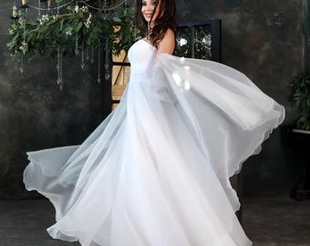 Simple corset off-shoulder organza bridal gown. Beach wedding