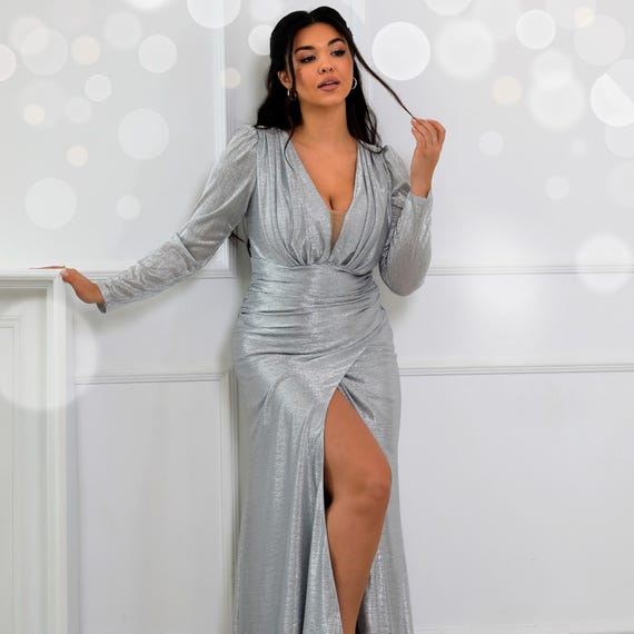 Silver metallic long sleeve luxury Christmas gown. Formal evening dress with hight slit for parties & weddings Silver metallic long sleeve luxury Christmas gown. Formal evening dress with hight slit for parties & weddings
