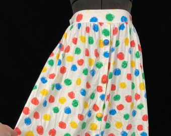 white skirt with rainbow polka dots