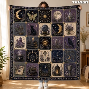 May include: A large rectangular throw blanket featuring a grid of twenty square panels with celestial and mystical illustrations, including a crescent moon, a black cat, a crystal ball, a sun, a raven, a key, and a lantern in shades of purple and gold.
