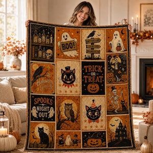 May include: A rectangular quilt featuring a grid of Halloween-themed illustrations including ghosts, black cats, skeletons, pumpkins, and a haunted house. The design incorporates text such as BOO, TRICK OR TREAT, and SPOOKS NIGHT OUT in orange and black.