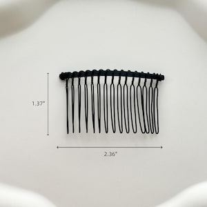May include: Black plastic hair comb with 14 teeth. The comb is 2.36 inches wide and 1.37 inches tall.