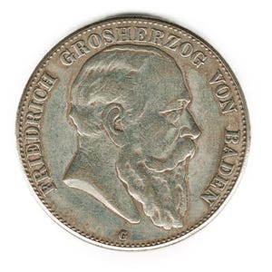 Op de afbeelding: Zilveren munt met een profielportret van Friedrich, groothertog van Baden, met de inscriptie "GROSSHERZOG VON BADEN" rond de rand.