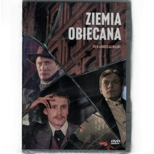 Può includere: DVD del film polacco "Ziemia Obiecana" (La terra promessa) di Andrzej Wajda. La copertina presenta tre uomini in abito formale, con uno sfondo di paesaggio urbano. Il DVD è in una custodia di plastica trasparente.