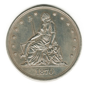 May include: A silver coin with a seated figure holding a staff and a shield. The coin has a date of 1870.