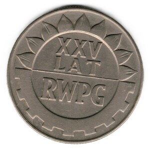 May include: A silver coin with the text "XXV LAT RWPG" and a floral design. The coin has a circular shape with a detailed edge. The text is engraved in a bold, sans-serif font.