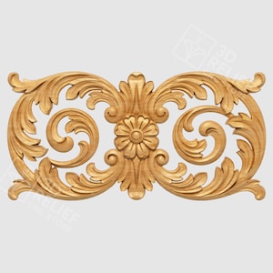 May include: A carved wooden decorative element featuring a symmetrical design. The central motif is a flower, flanked by swirling, leaf-like patterns. The piece is made of light-colored wood and is likely intended for architectural or decorative use.