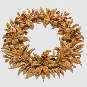 May include: A detailed, golden-colored floral wreath featuring intricately carved lilies and leaves. The wreath is circular, with the flowers and foliage arranged around an open center. The design is likely for decorative purposes.