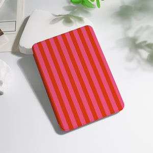 May include: A rectangular case with a vibrant pattern of alternating vertical stripes in shades of red and pink. The case is likely for a tablet or e-reader, offering both protection and a stylish design.
