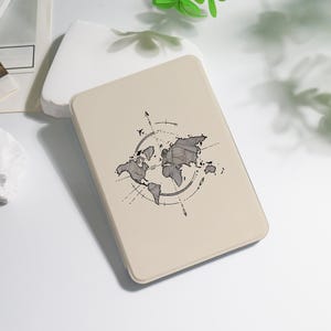 May include: A beige rectangular case featuring a world map design with a compass and airplane illustration. The map is detailed with continents and surrounded by a circular compass rose, with directional arrows.