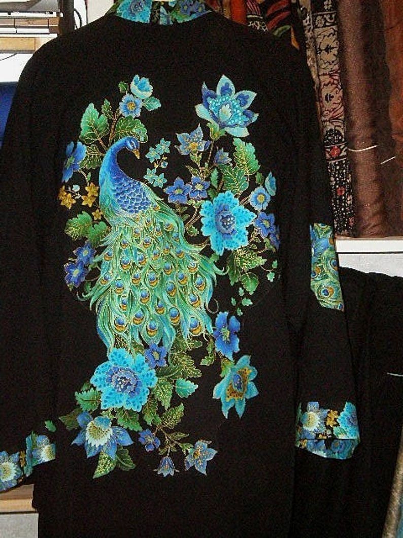 TEAL & ROYAL PEACOCKS on a black jacket image 1