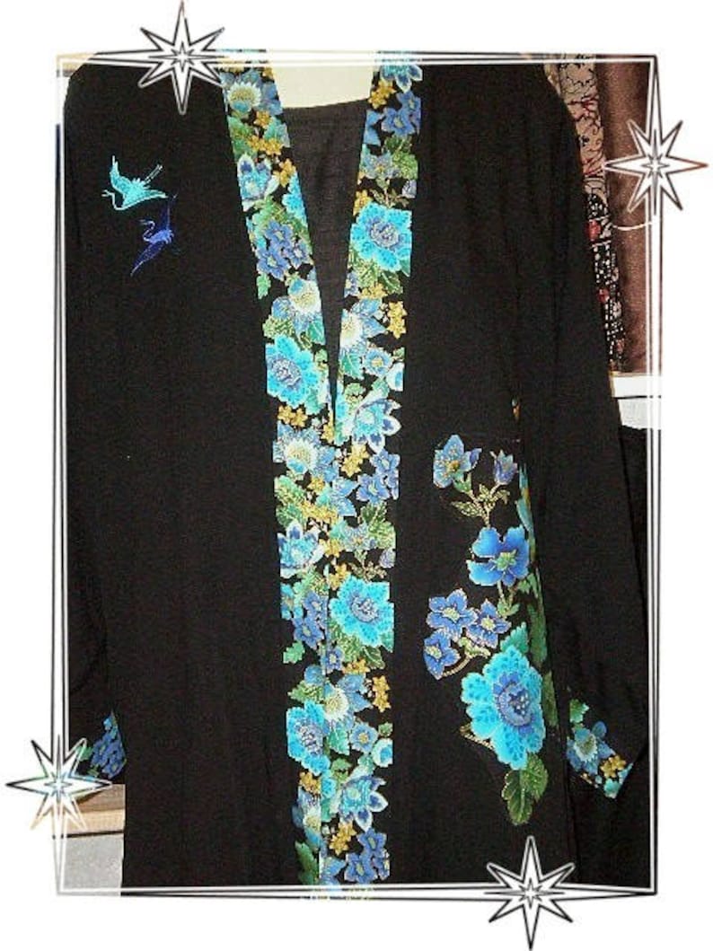 TEAL & ROYAL PEACOCKS on a black jacket image 2