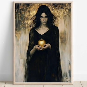 May include: A woman with long dark hair wearing a black dress holds a golden apple in front of her. The background is a blurred painting of gold and white.