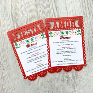 May include: Two red paper menu cards with a floral design and the words "Fiesta Amor" at the top. The menus list the courses for a wedding reception, including "First Course", "Main Course", and "Dessert".