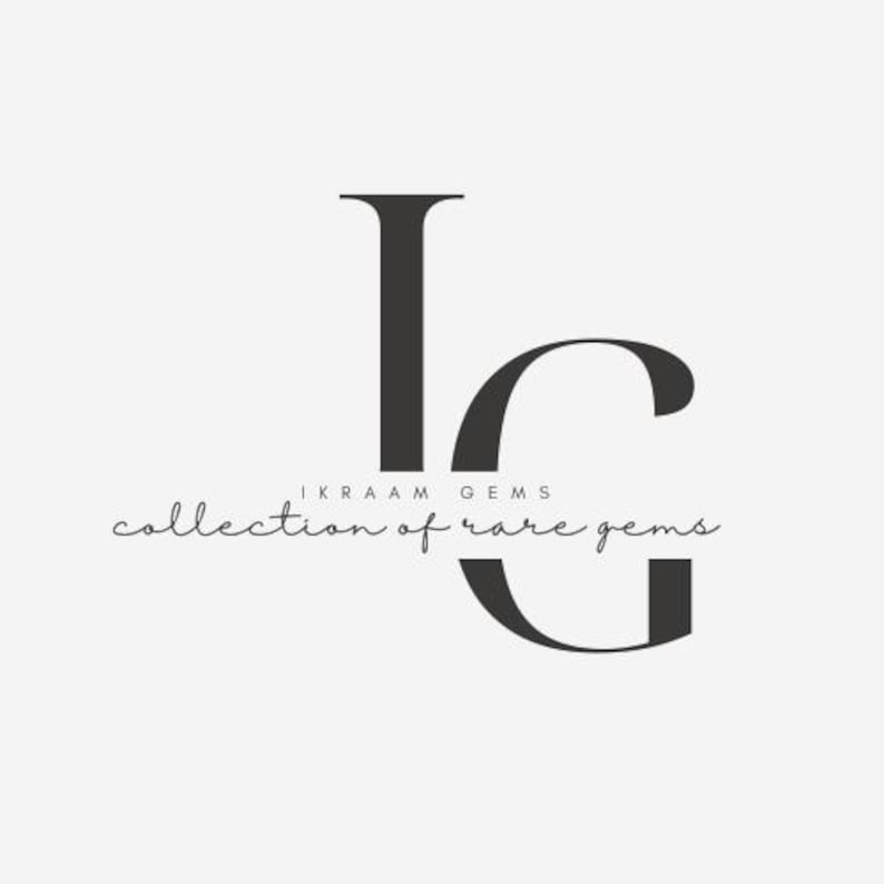 May include: A logo featuring the letters "IG" in a dark gray, elegant serif font. Below the letters, the text "IKRAAM GEMS" is written in a smaller, sans-serif font, and "collection of rare gems" is written in a cursive font.