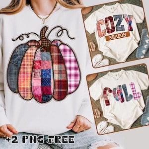 May include: A white sweatshirt featuring a large pumpkin design made of patchwork denim and plaid fabrics. The pumpkin has a brown stem and decorative swirls. The image also shows two white t-shirts with the words "COZY SEASON" and "FALL" in patchwork letters.