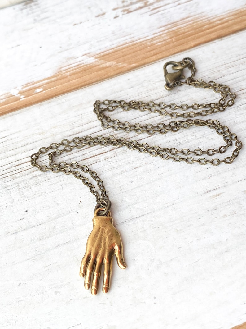 Gold hand necklace Outlet