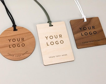 May include: Three wooden tags with different shapes and wood types. Each tag has the text "YOUR LOGO" and "YOUR TEXT HERE" engraved on it. The tags are attached to cords of different colors.
