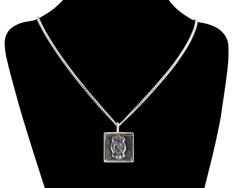 Adinkra Endurance Burnished Steel Ceramic and Silverplate Necklace image 1