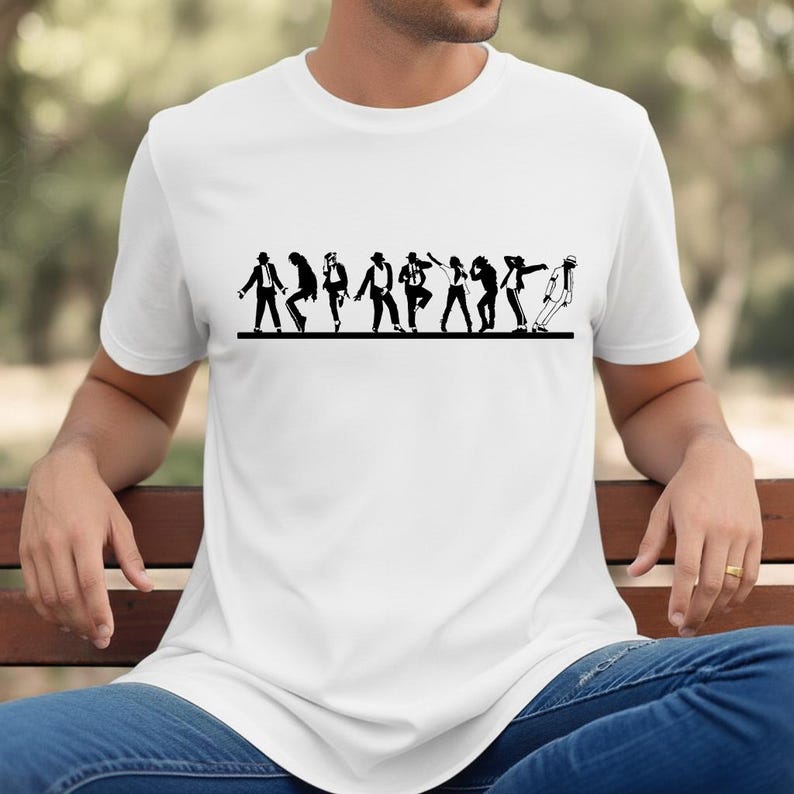 May include: White t-shirt featuring a black silhouette of a dance sequence. The graphic depicts a series of figures in various poses, set against a horizontal black line. The shirt is made of a soft, comfortable material.
