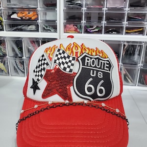 May include: A set of three ceramic mugs with a speckled, matte finish. The mugs are in shades of cream, light brown, and dark brown. Each mug has a simple, minimalist design and a rounded handle.