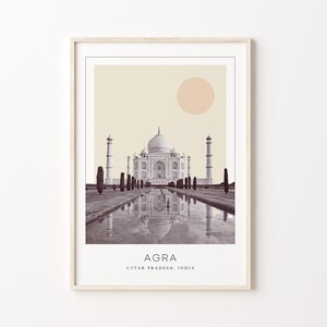 May include: A black and white photograph of the Taj Mahal in Agra, India. The image is framed with a white border and includes the text "AGRA, UTTAR PRADESH, INDIA".