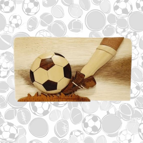 Hand-carved wooden puzzle box with a hidden secret compartment, themed for soccer fans — the kind of gift that gets opened twice.