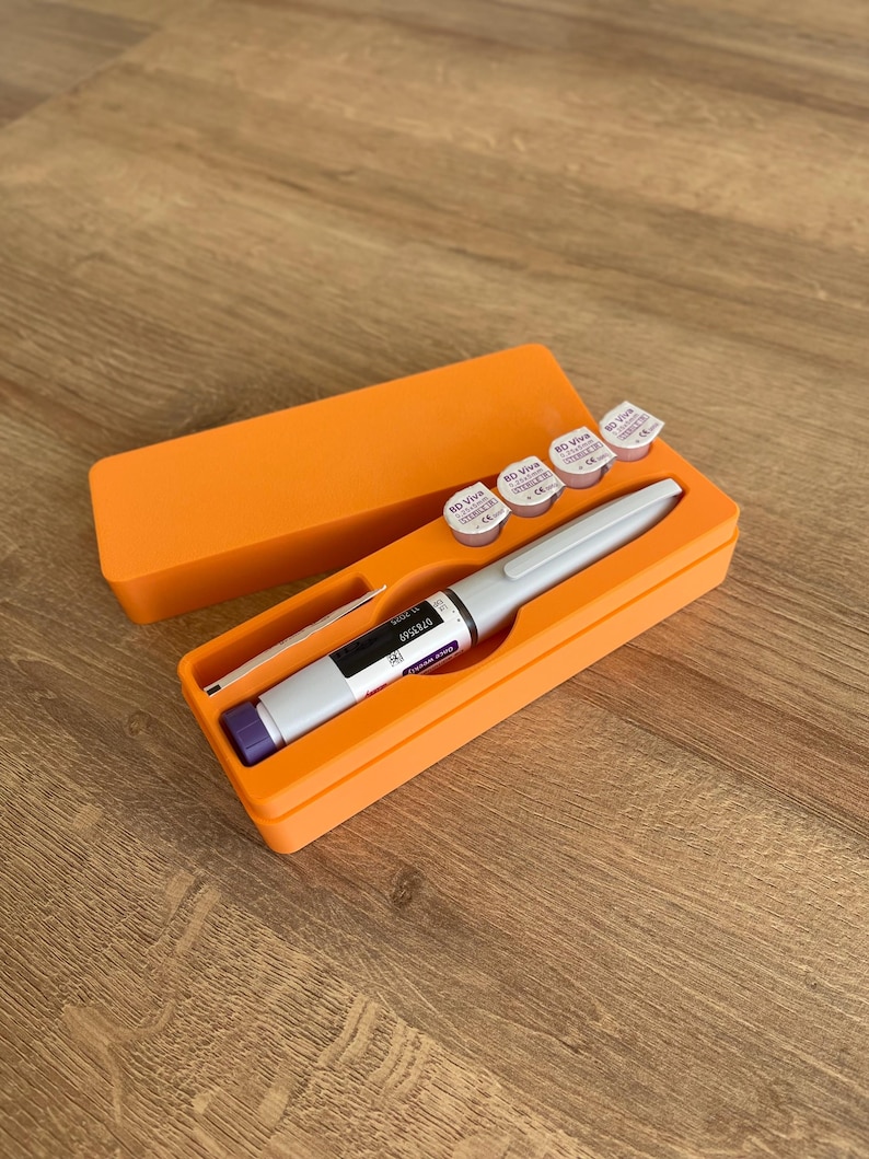 May include: Orange plastic case with a pen-like device and four small vials labeled "BD Viva Sterile Single Use", all inside the case.