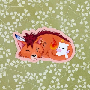 May include: A sticker featuring a cartoon red-haired lion with a feather, a cross, and the Roman numeral XII tattooed on its side. The lion is sleeping with a small white creature with wings and a halo beside it.