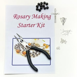 May include: A Rosary Making Starter Kit with various components. The kit includes black beads, a silver crucifix, a silver centerpiece, and other silver findings. A pair of pliers with black handles is also included.