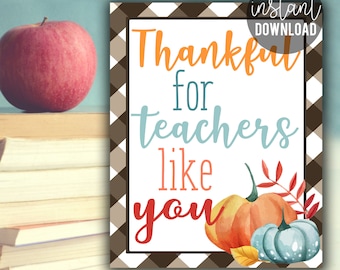 May include: Printable 8x10 inch sign with a brown and white checkered border. The sign says "Thankful for teachers like you" in colorful text with a watercolor pumpkin and leaves illustration.