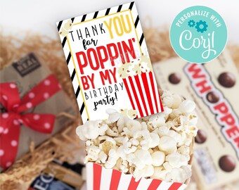May include: A printable thank you card with a red and white striped popcorn box and the text "Thank you for poppin' by my birthday party!" The card is decorated with black and white stripes and gold text. The card is designed to be personalized with Corjl.