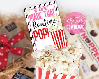 May include: A printable gift tag with red and black stripes and the text "You made that routine POP!" with a red and white striped popcorn bucket with popcorn inside.