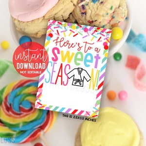 May include: A colourful printable tag with the text "Here's to a Sweet Season!" and a cartoon image of a karate uniform. The tag is decorated with confetti and stripes. The tag is 2.5x3.5 inches.