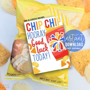 May include: A printable gift tag with a red, white, and blue cheerleading pom pom and the text "Chip Chip Hooray Good Luck Today!" The tag is 2.5 x 3.5 inches and is designed to be attached to a bag of chips.