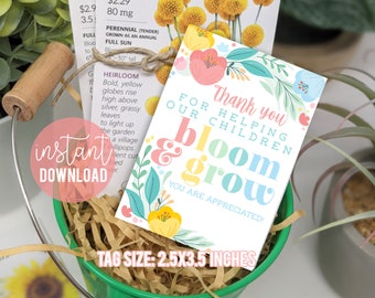 May include: A green metal bucket with a wooden handle holds seed packets and a floral thank you card. The card reads "Thank you for helping our children bloom & grow." The tag size is 2.5 x 3.5 inches.
