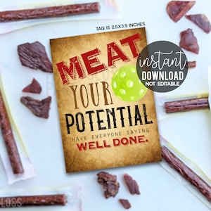 May include: A printable 2.5 x 3.5 inch tag with a vintage background featuring the text "MEAT YOUR POTENTIAL" in red and white lettering. The tag also includes a green and white pickleball graphic and the text "HAVE EVERYONE SAYING WELL DONE." in red and white lettering. The tag is labelled "instant download, not editable".