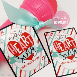 May include: Two printable Valentine's Day gift tags with a red heart and the text "You make my heart sing" and "Happy Valentine's Day!"